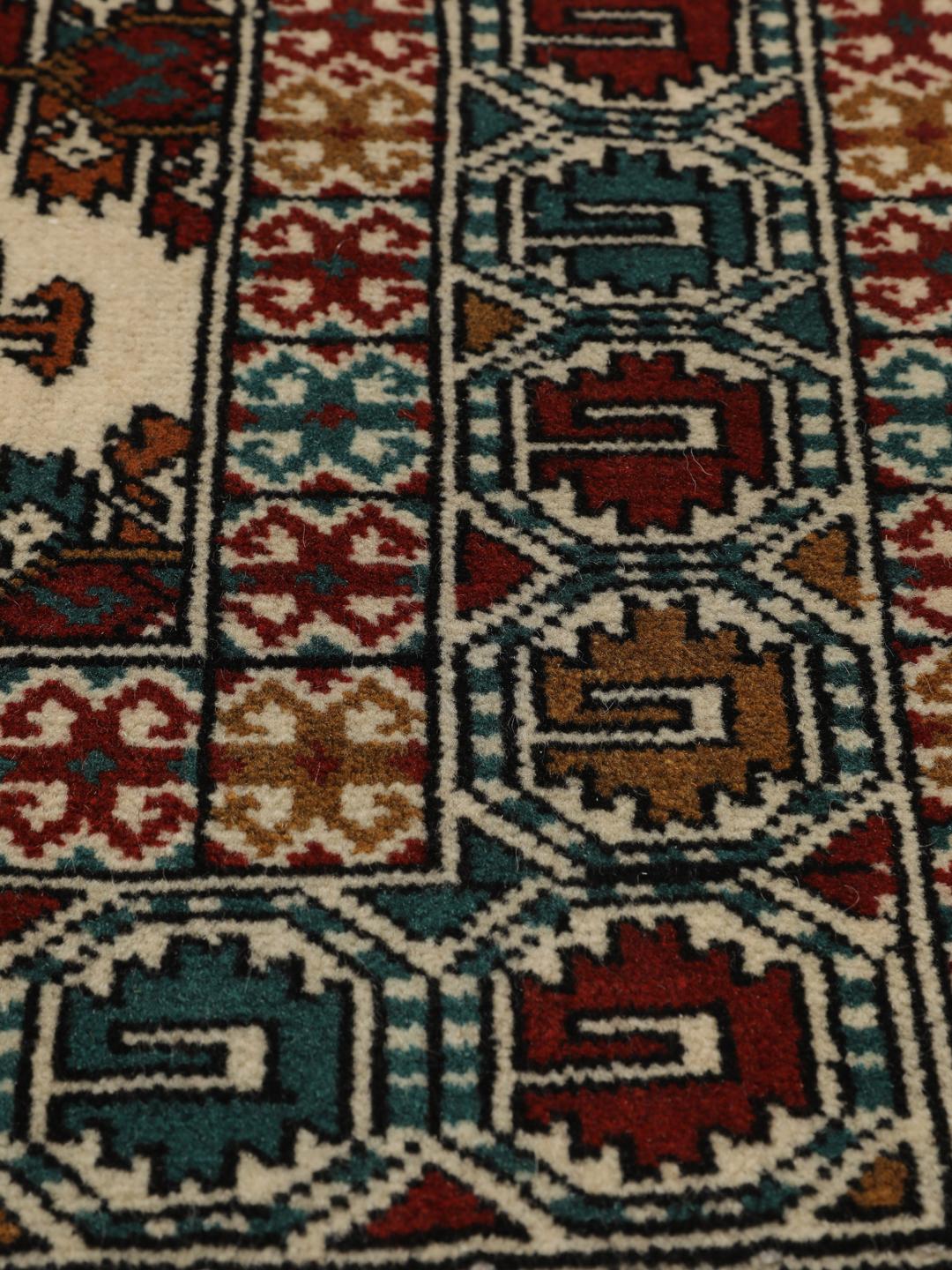 Hand-knotted Turkaman rug from the Middle East in beige with repeating geometric motifs