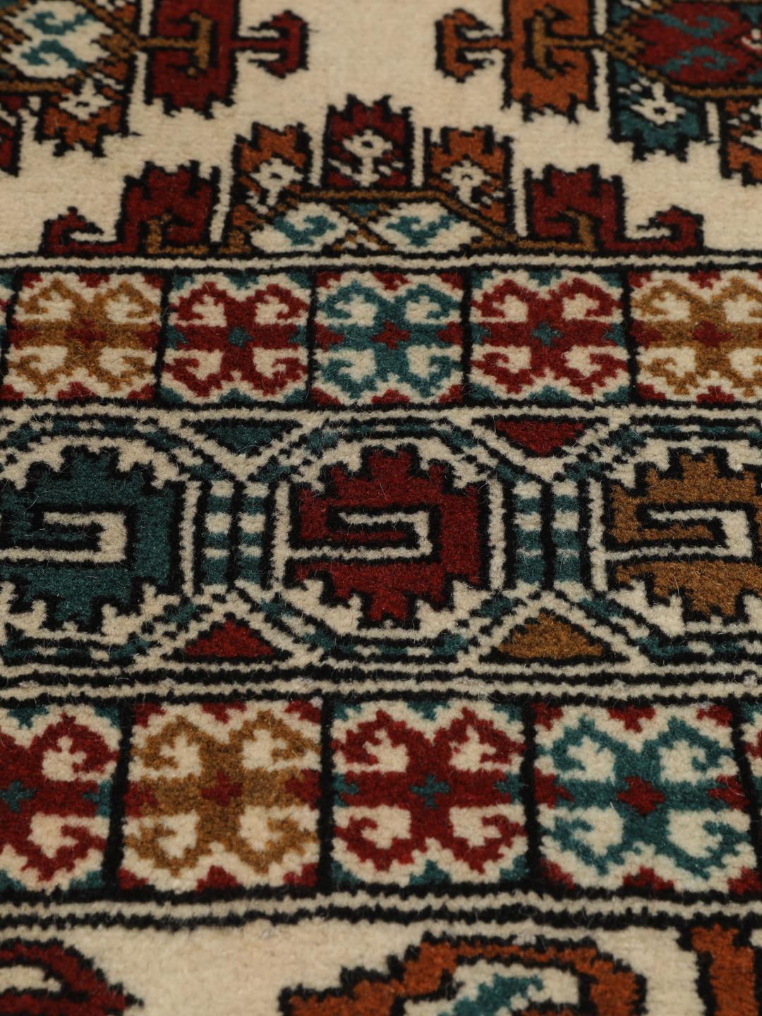 Hand-knotted Turkaman rug from the Middle East in beige with repeating geometric motifs