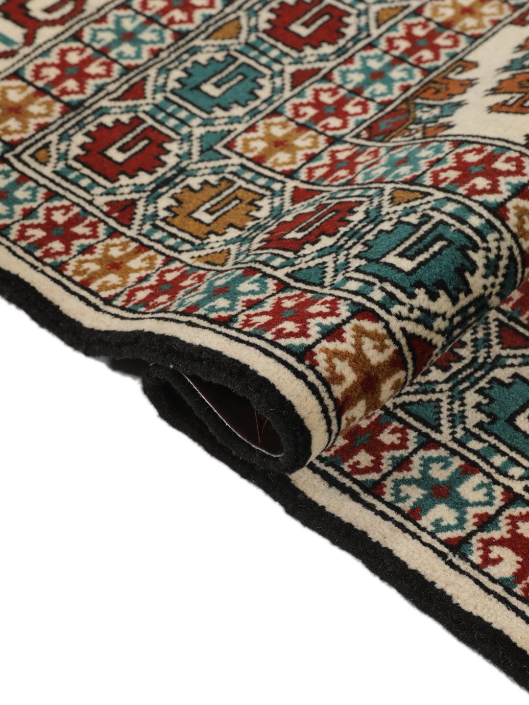 Hand-knotted Turkaman rug from the Middle East in beige with repeating geometric motifs