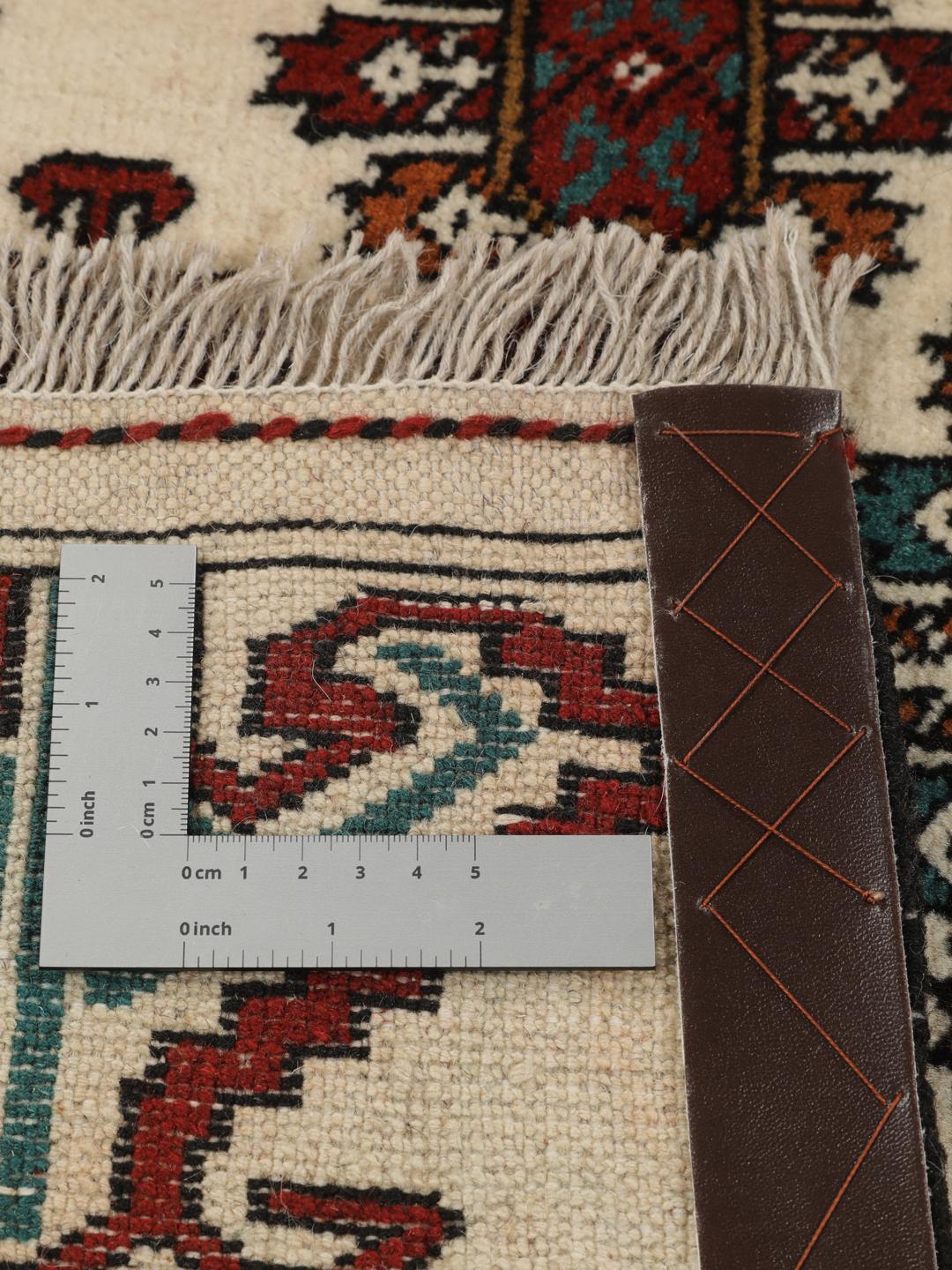 Hand-knotted Turkaman rug from the Middle East in beige with repeating geometric motifs