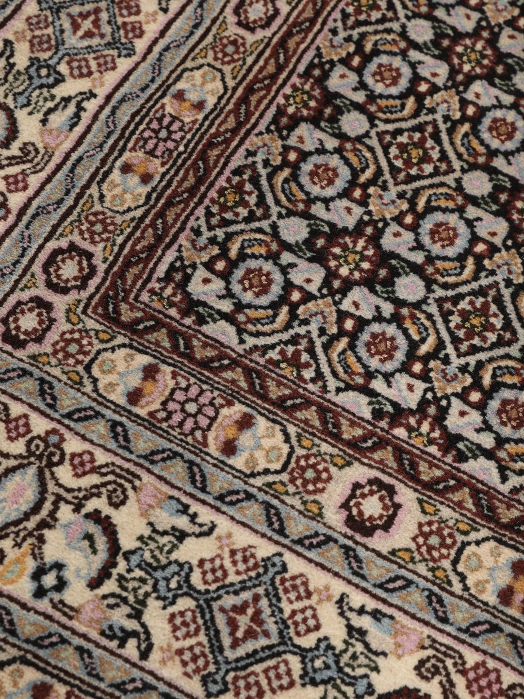 Hand-knotted Moud rug with intricate patterns in multicolor Wool, origin Middle East.