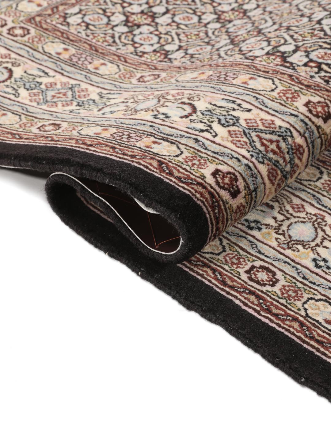 Hand-knotted Moud rug with intricate patterns in multicolor Wool, origin Middle East.