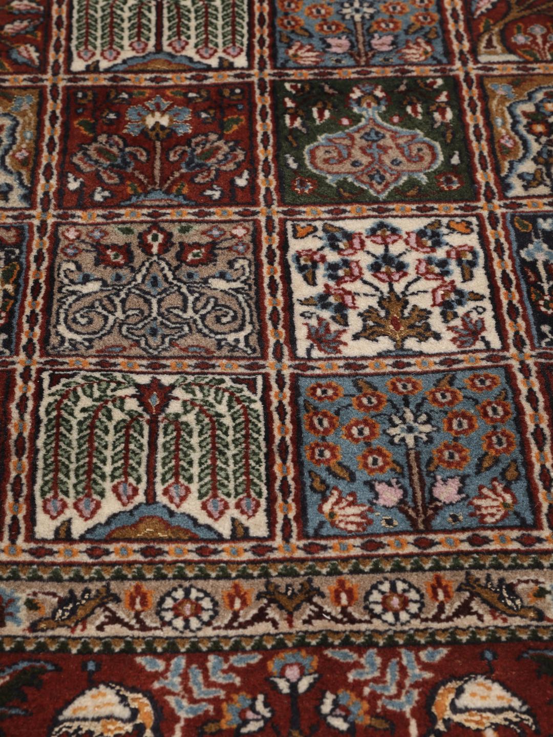 Hand-knotted Moud rug from the Middle East in dark-red and multicolour
