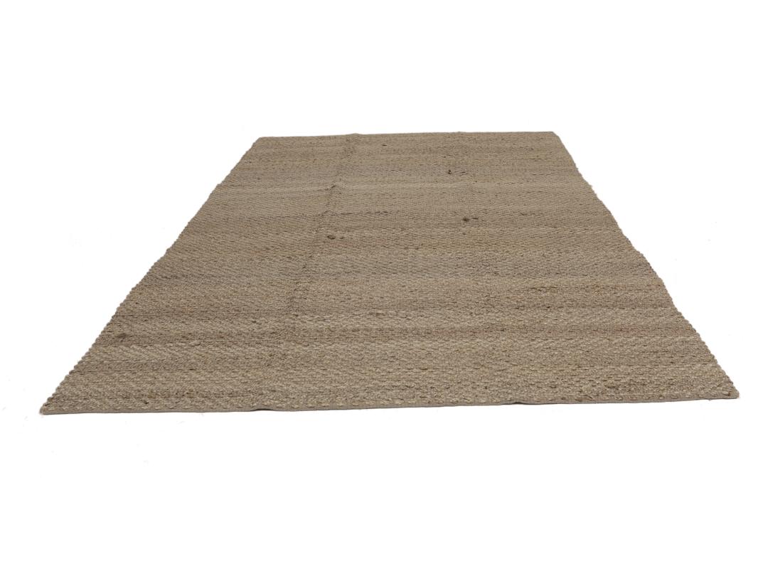 Handgeweven jute tapijt uit India in een natuurlijke beige tint