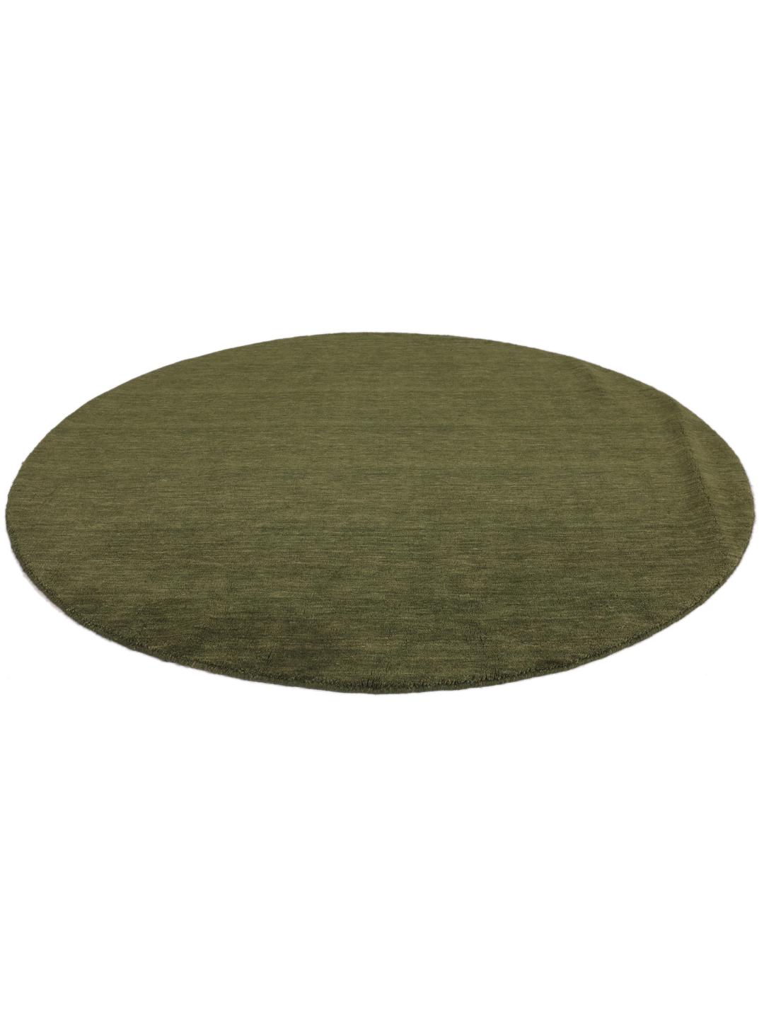 Round green rug in a simple, solid design