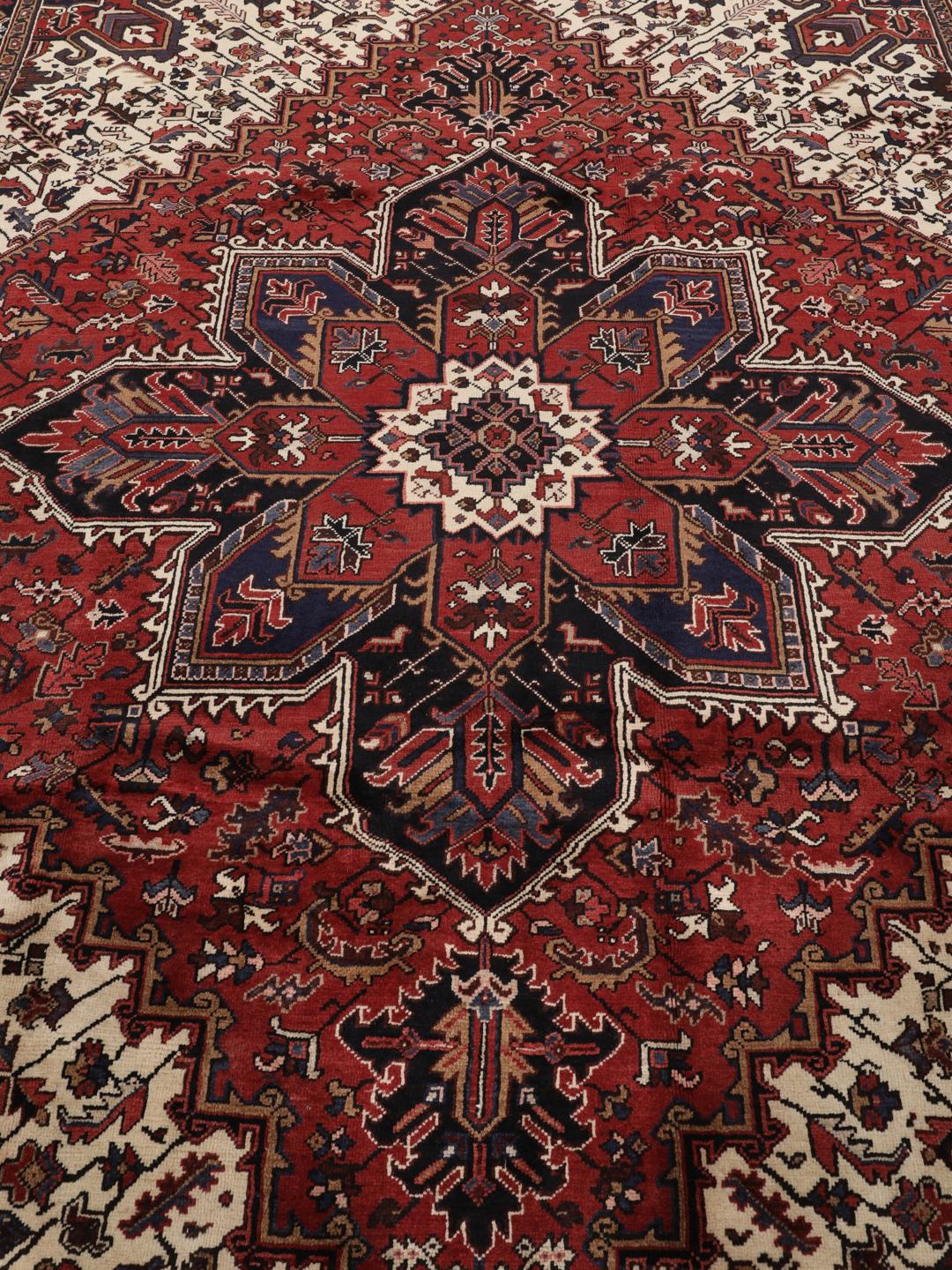 Hand-knotted Heriz rug from the Middle East in red and blue tones