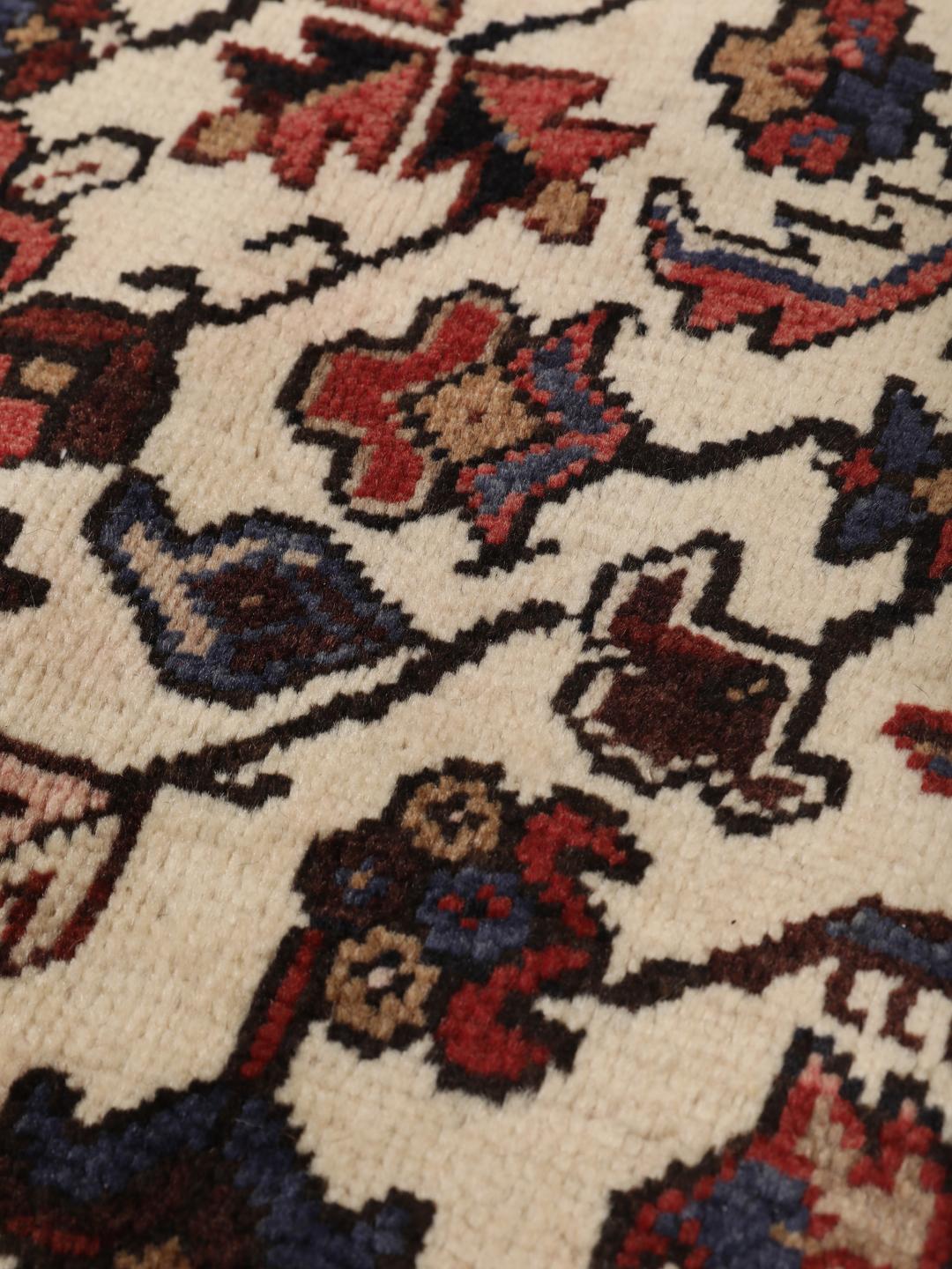 Hand-knotted Heriz rug from the Middle East in red and blue tones