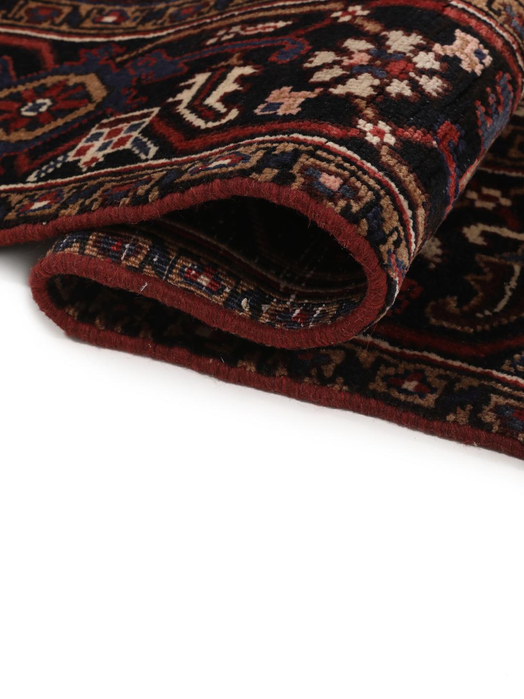Hand-knotted Heriz rug from the Middle East in red and blue tones