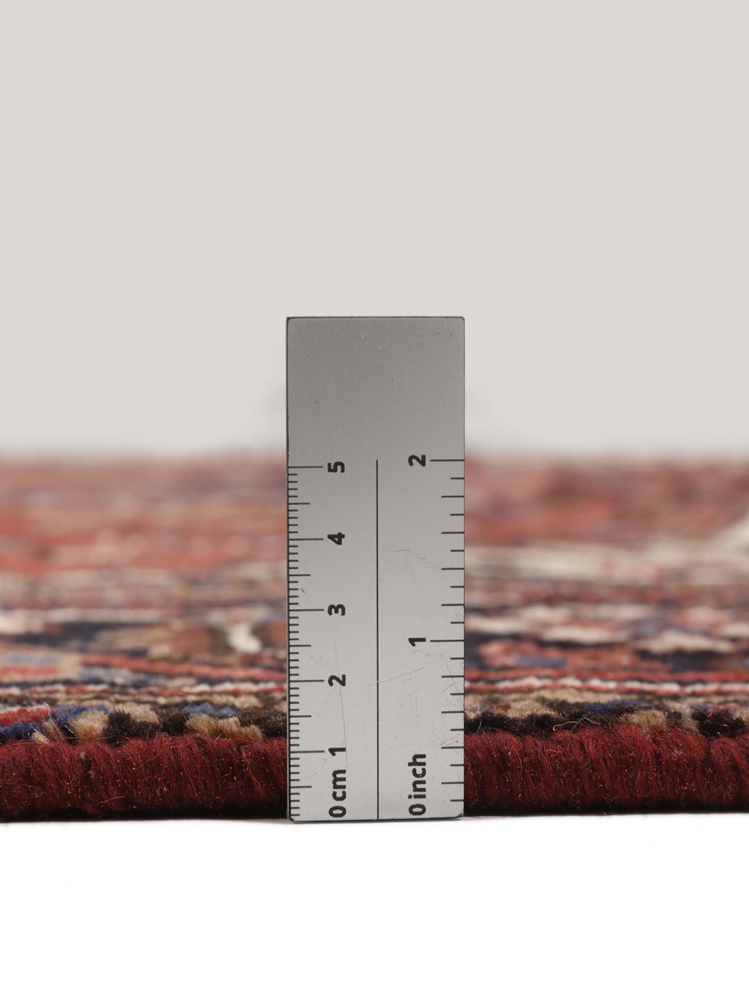 Hand-knotted Heriz rug from the Middle East in red and blue tones