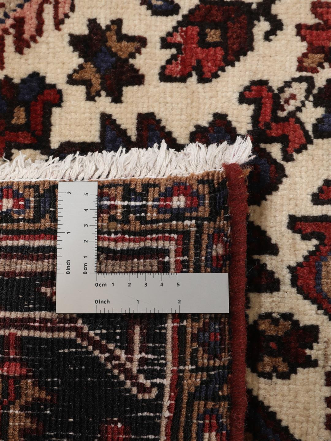 Hand-knotted Heriz rug from the Middle East in red and blue tones