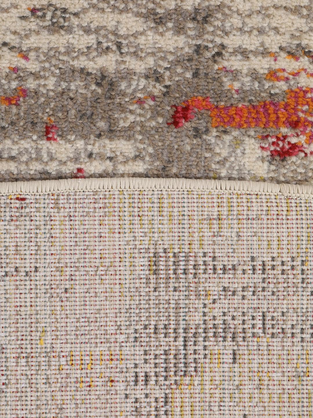 Rond meerkleurig vloerkleed met een abstract design