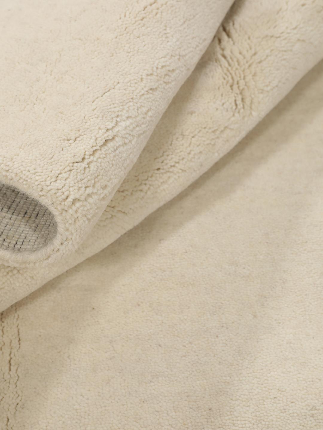 Vierkant beige vloerkleed met franjes