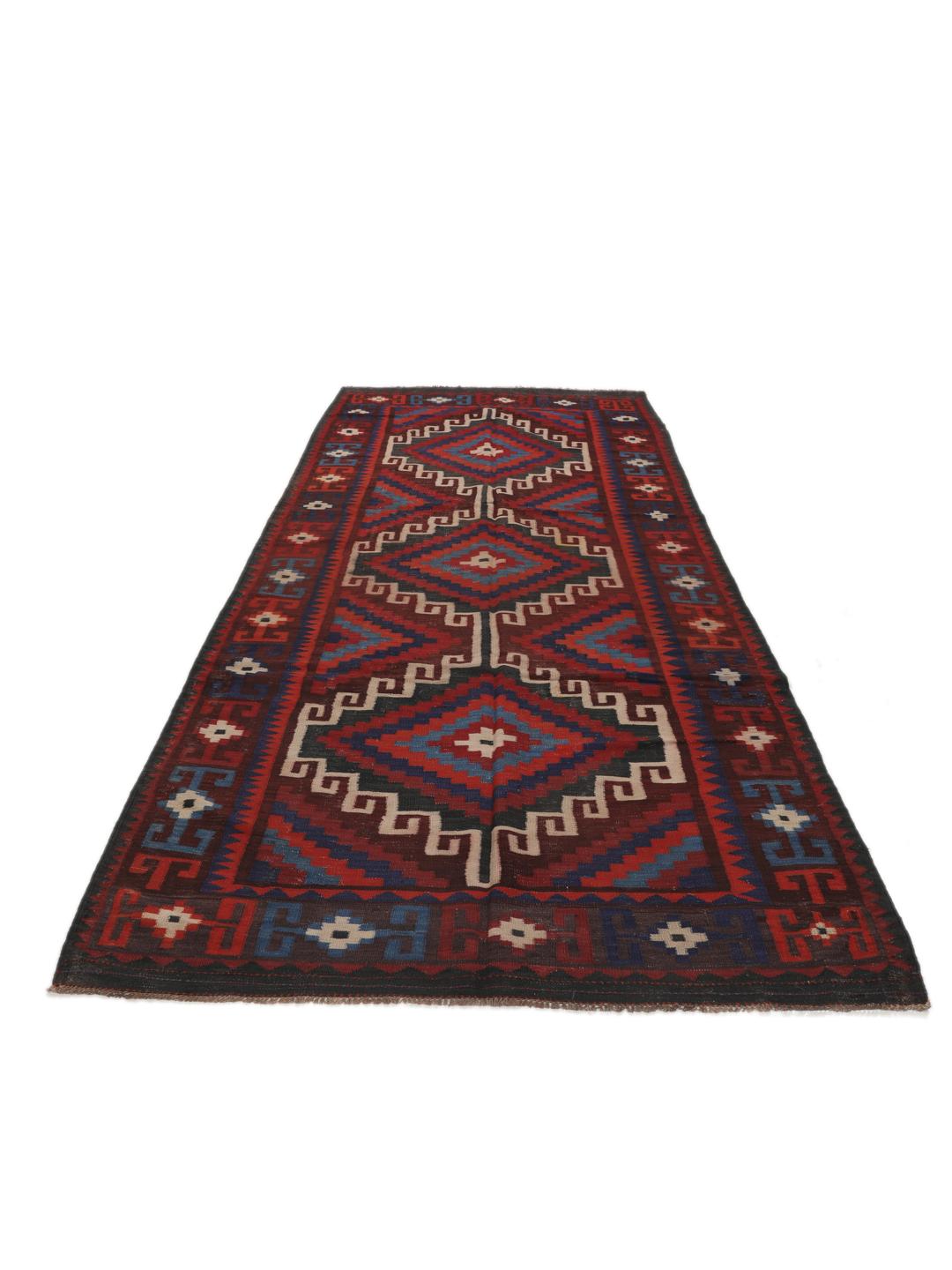 Tapis Kelim afghan tissé à la main avec des motifs géométriques en losange dans les tons rouge, bleu et noir.