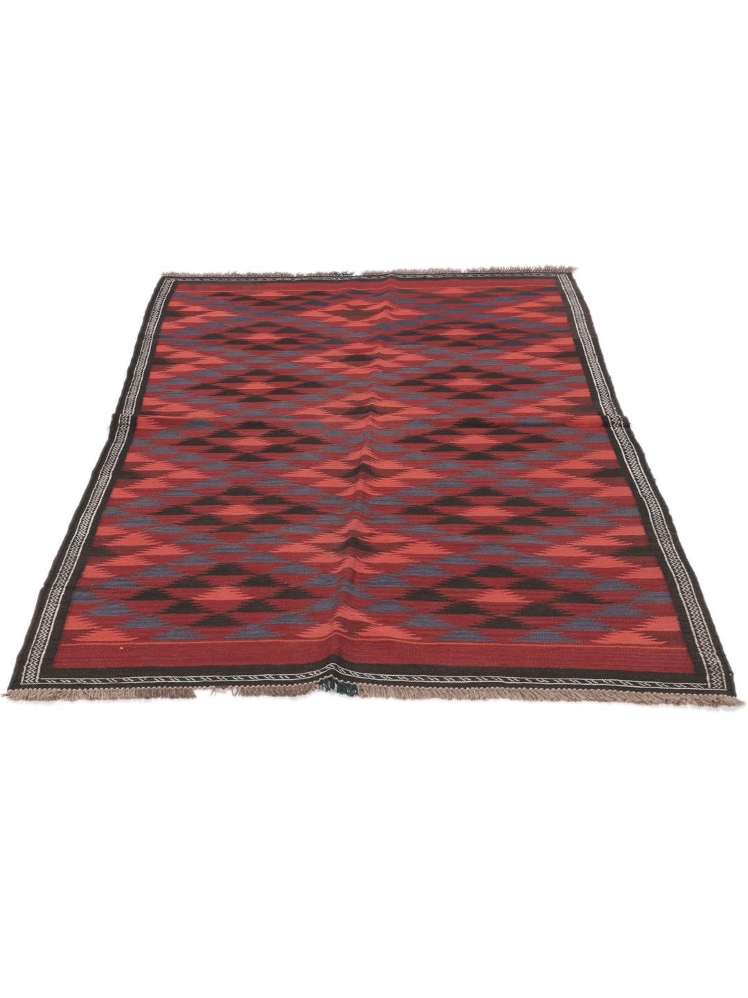 Tapis kelim afghan tissé à la main avec des motifs géométriques dans des tons rouges et sombres.