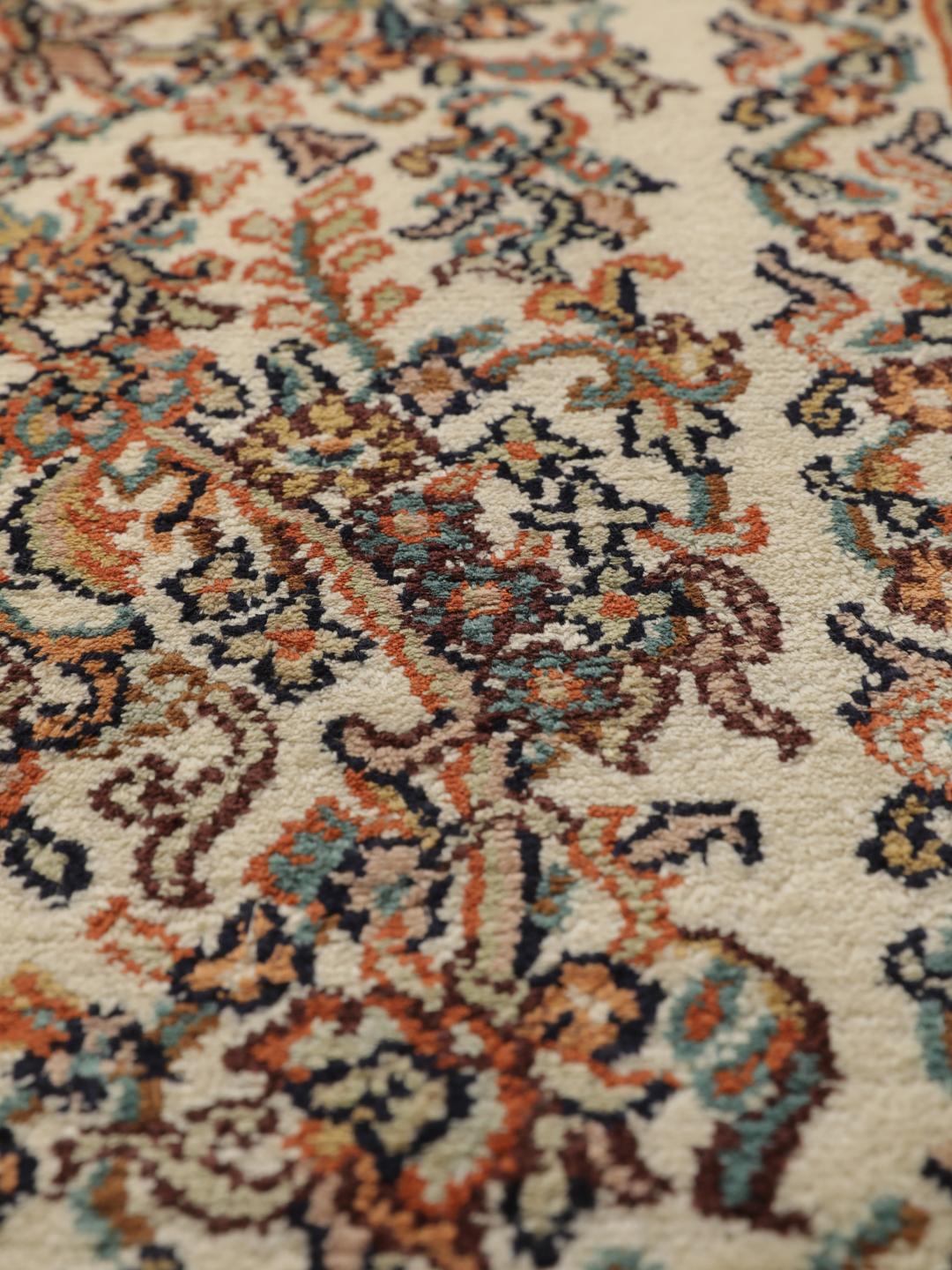 Kashmir silk rug from India with a beige and multicolor floral design