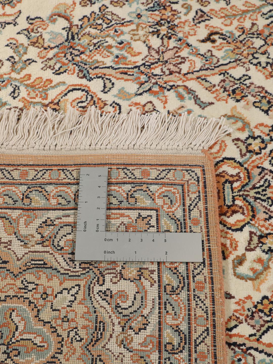 Kashmir silk rug from India with a beige and multicolor floral design