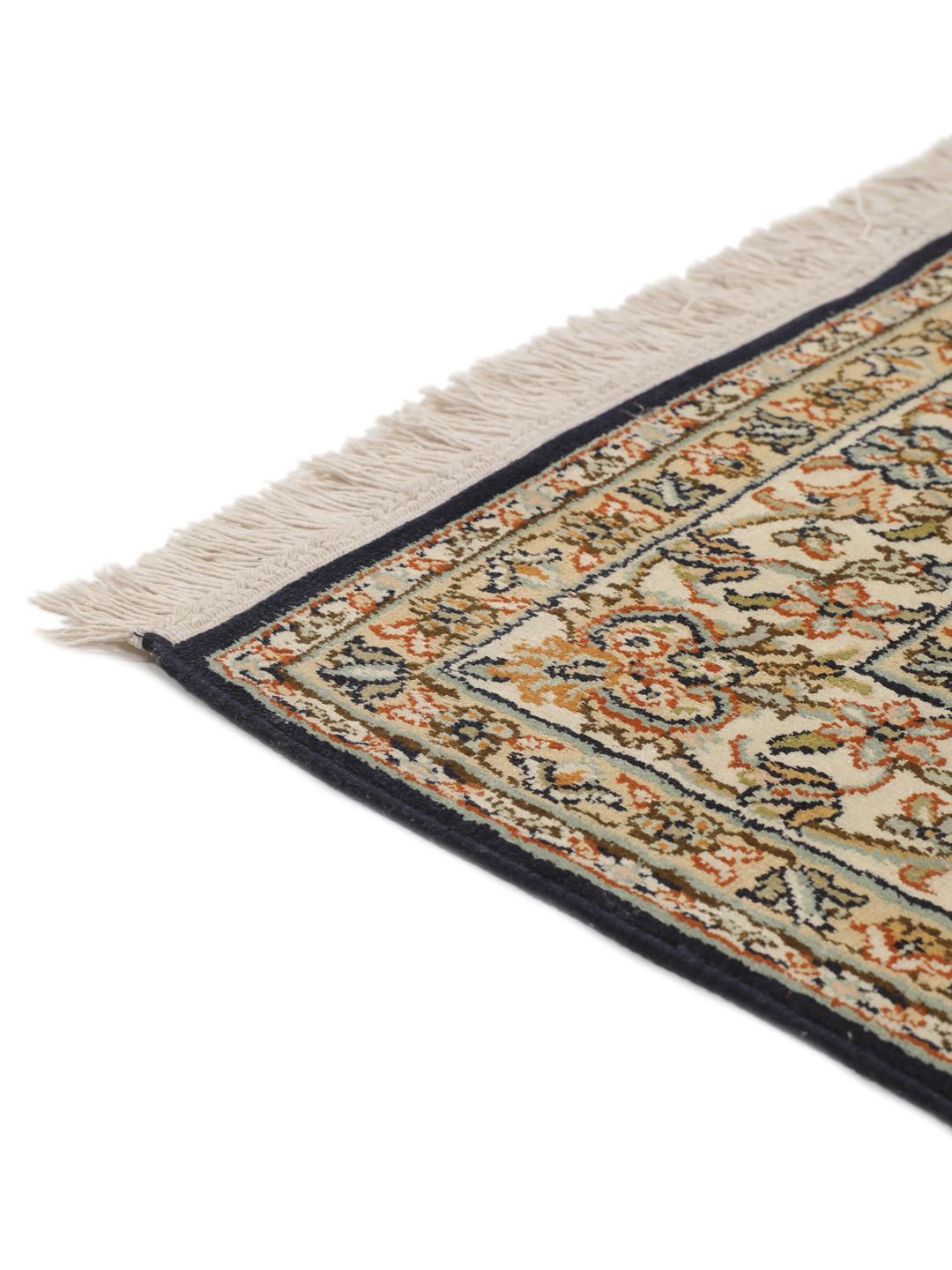 Hand-knotted Indian silk rug with intricate floral medallion patterns in blue and beige.