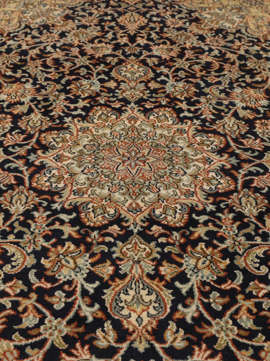 Hand-knotted Indian silk rug with intricate floral medallion patterns in blue and beige.