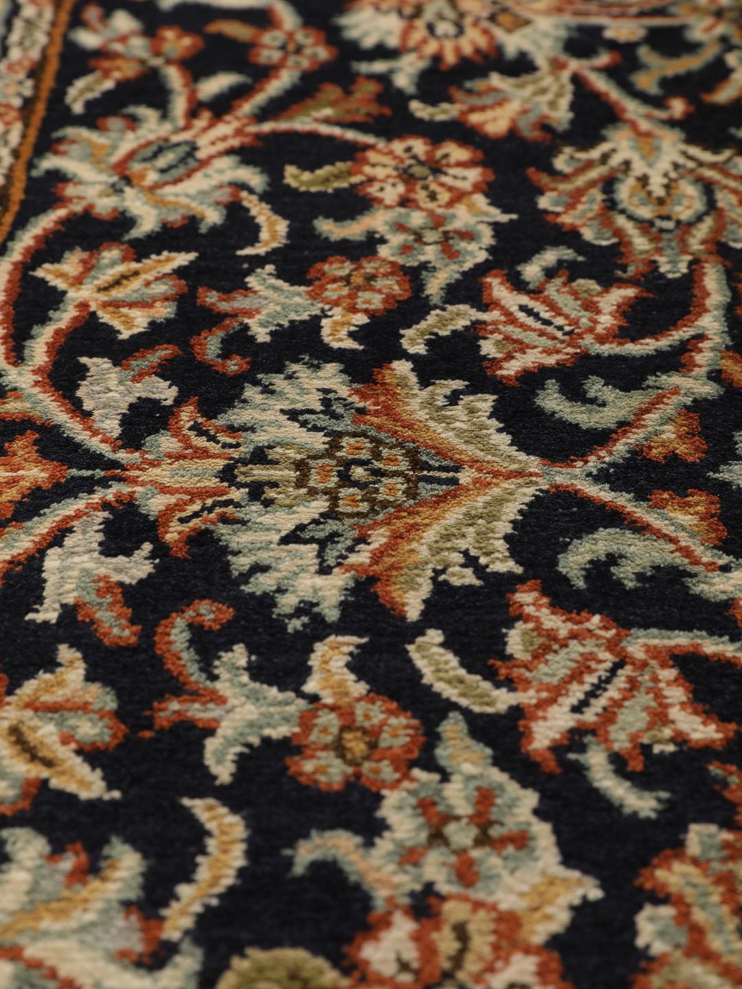Hand-knotted Indian silk rug with intricate floral medallion patterns in blue and beige.