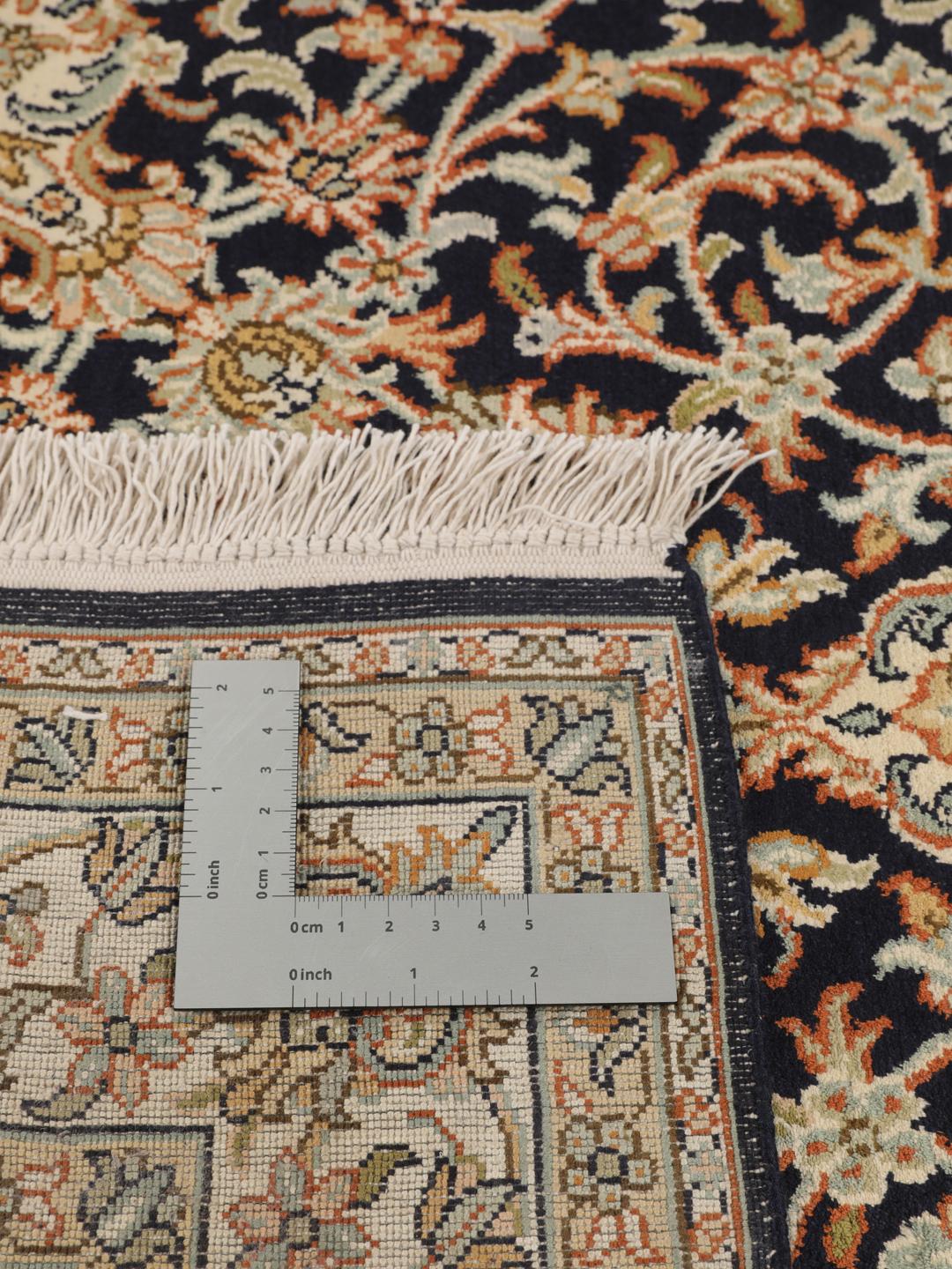 Hand-knotted Indian silk rug with intricate floral medallion patterns in blue and beige.