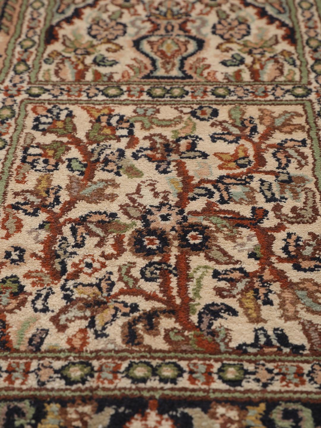 Hand-knotted Kashmir silk runner with a multicolour panelled design from India.