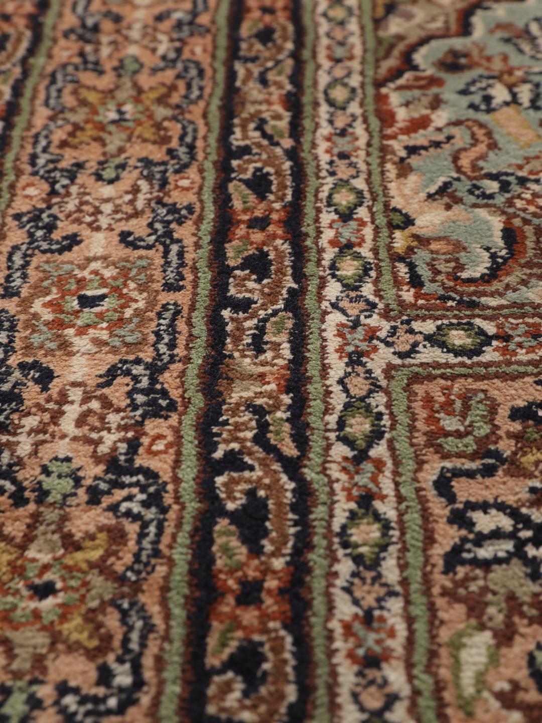 Hand-knotted Kashmir silk runner with a multicolour panelled design from India.