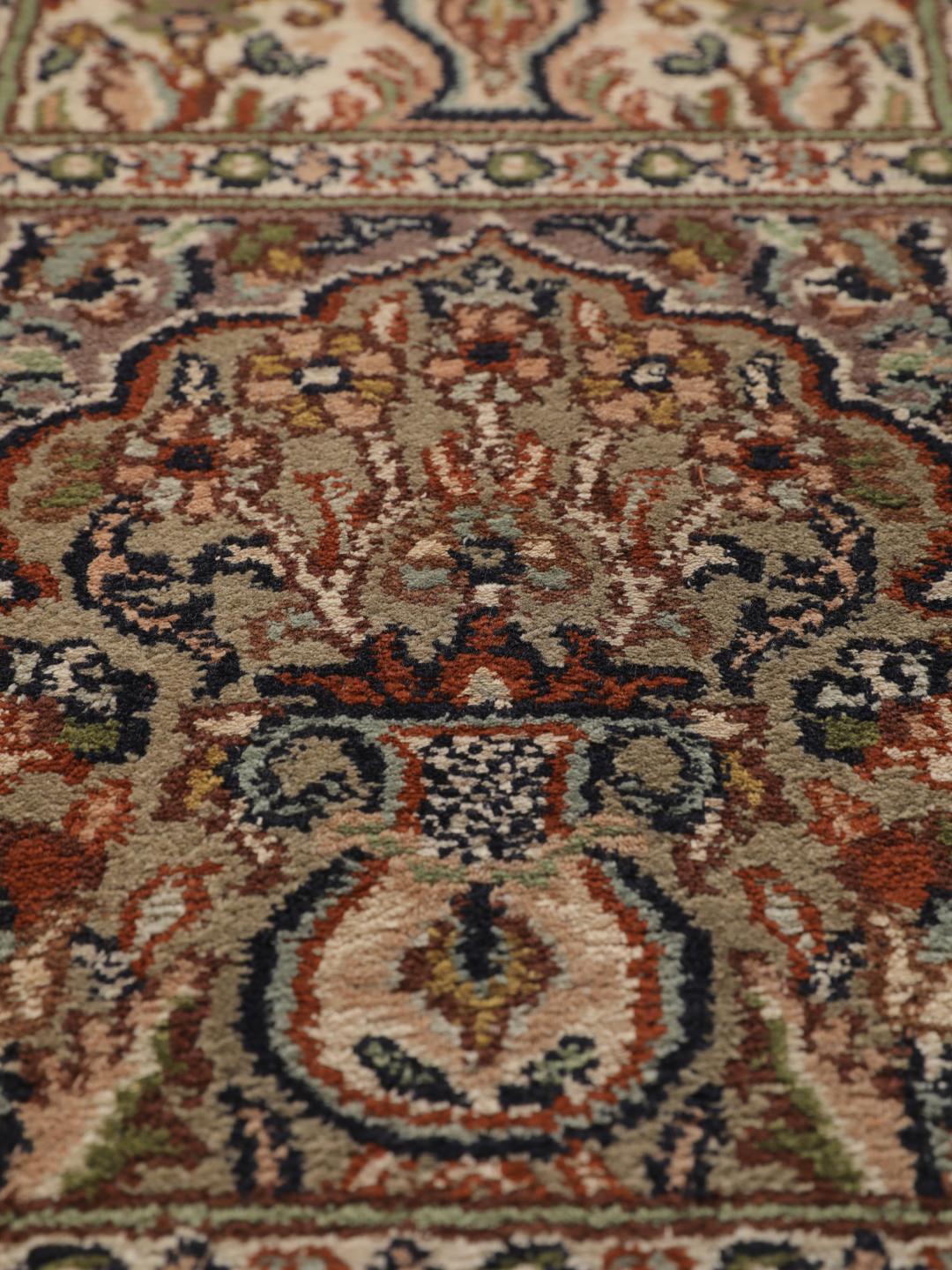Hand-knotted Kashmir silk runner with a multicolour panelled design from India.