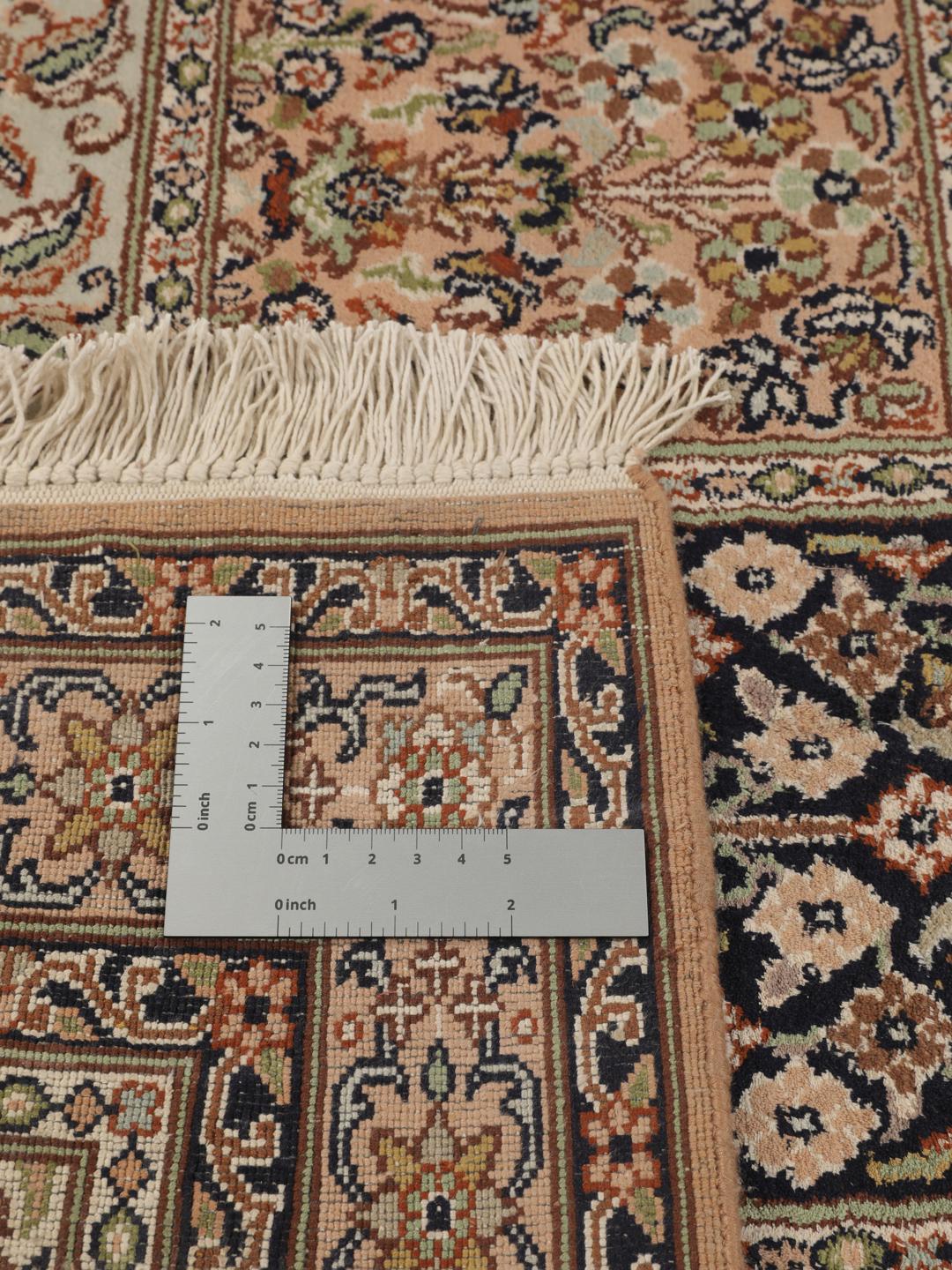 Hand-knotted Kashmir silk runner with a multicolour panelled design from India.