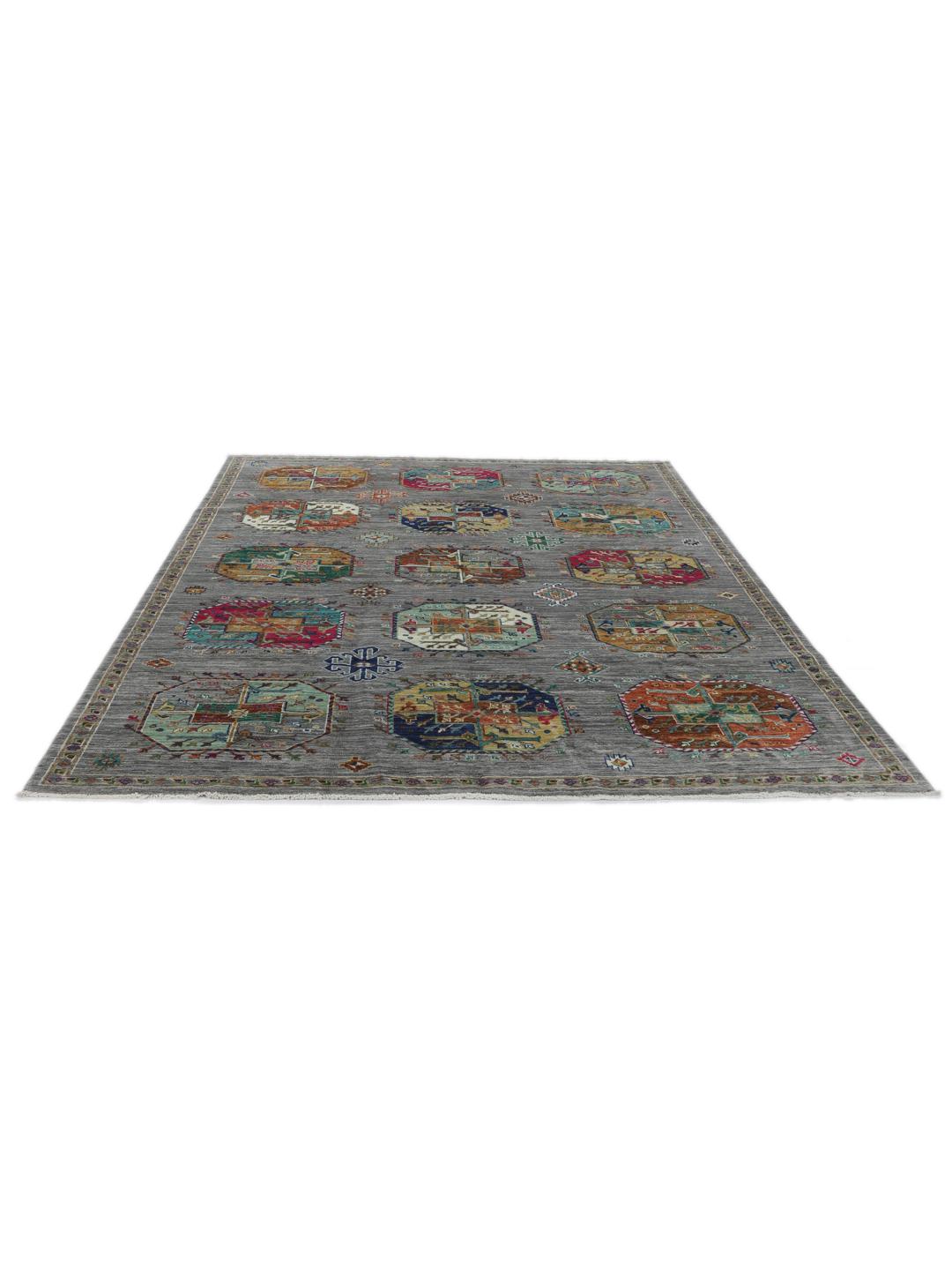 Hand-knotted rug from the Middle East with vibrant geometric medallions on a grey background