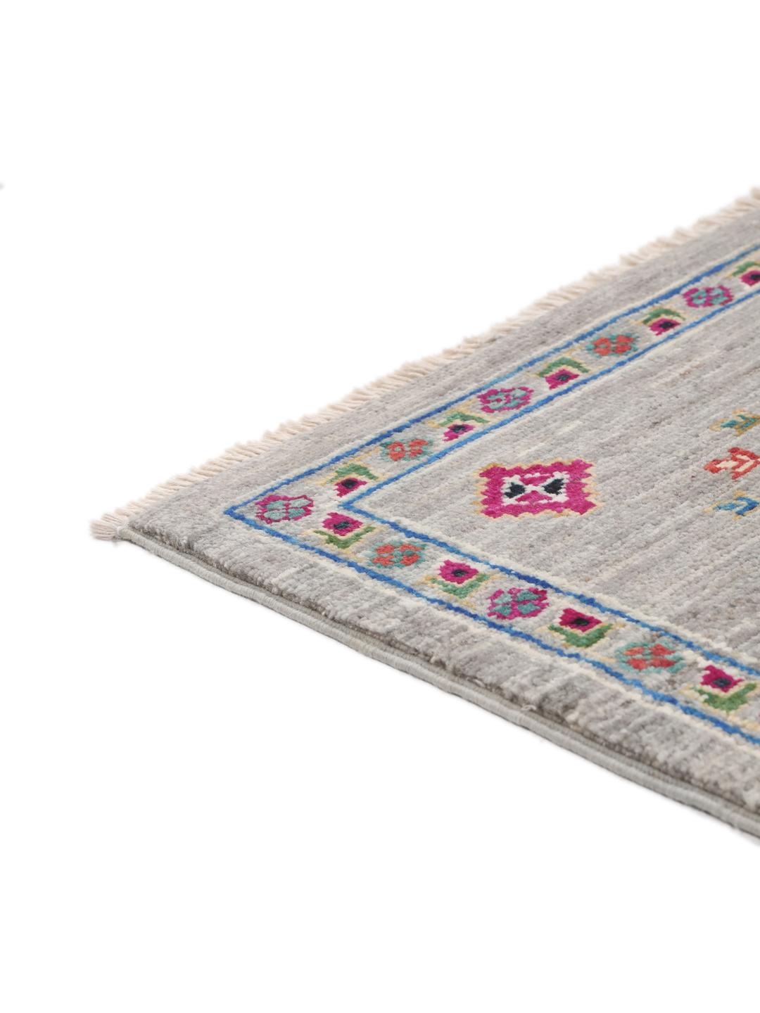 Hand-knotted Afghan rug with vibrant medallion patterns on a grey field