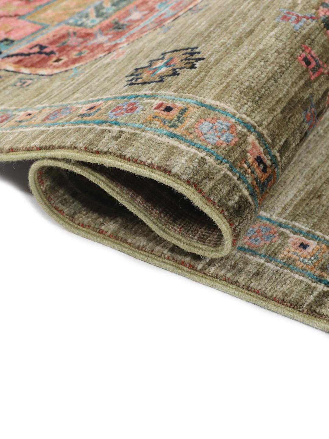 Hand-knotted Afghan rug with olive green field and multi-coloured geometric motifs.