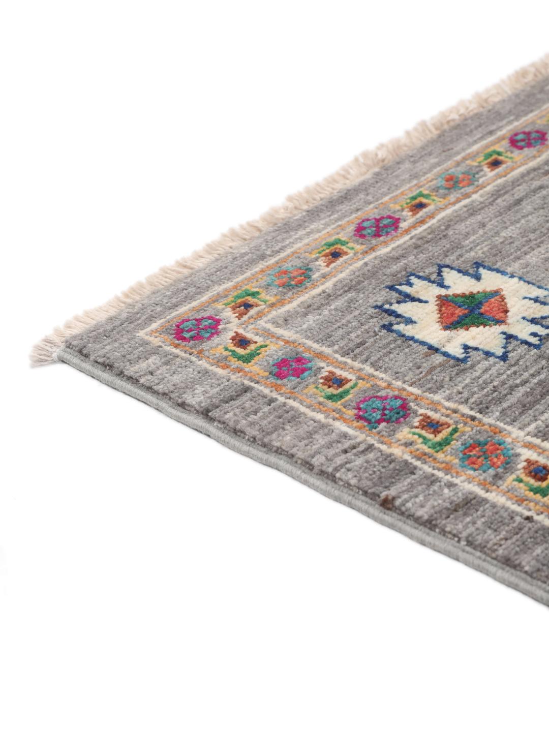 Hand-knotted Shabargan rug from the Middle East in dark-grey with vibrant geometric motifs