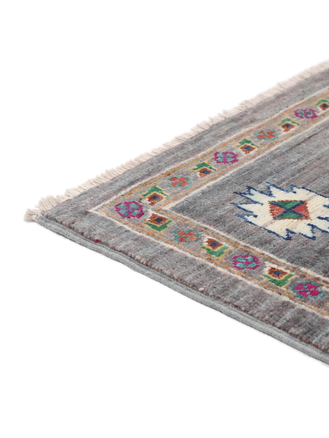 Tapis afghan noué à la main avec des médaillons géométriques vibrants sur un fond gris