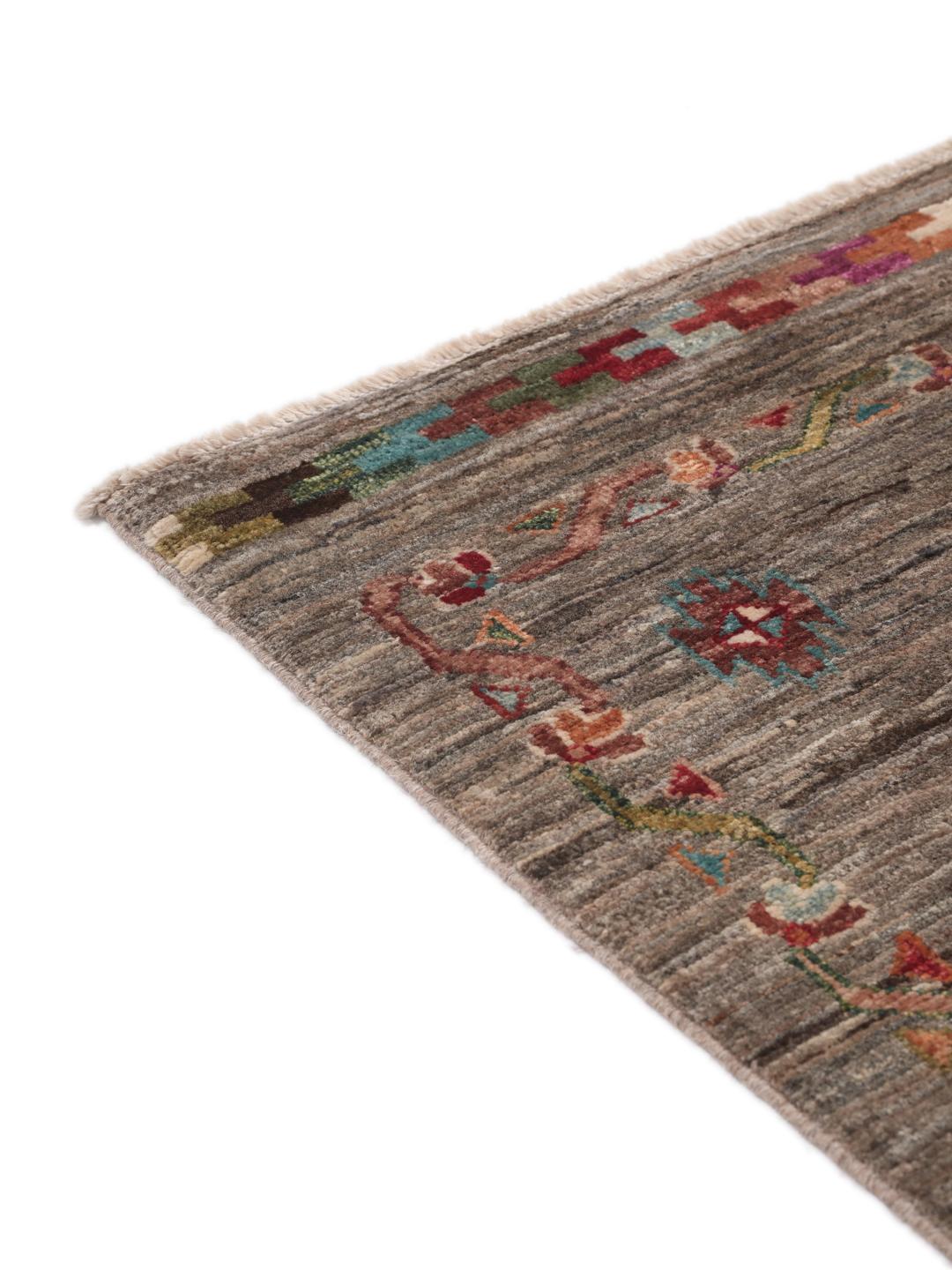 A unique Afghan wool runner featuring colourful geometric motifs on a grey background