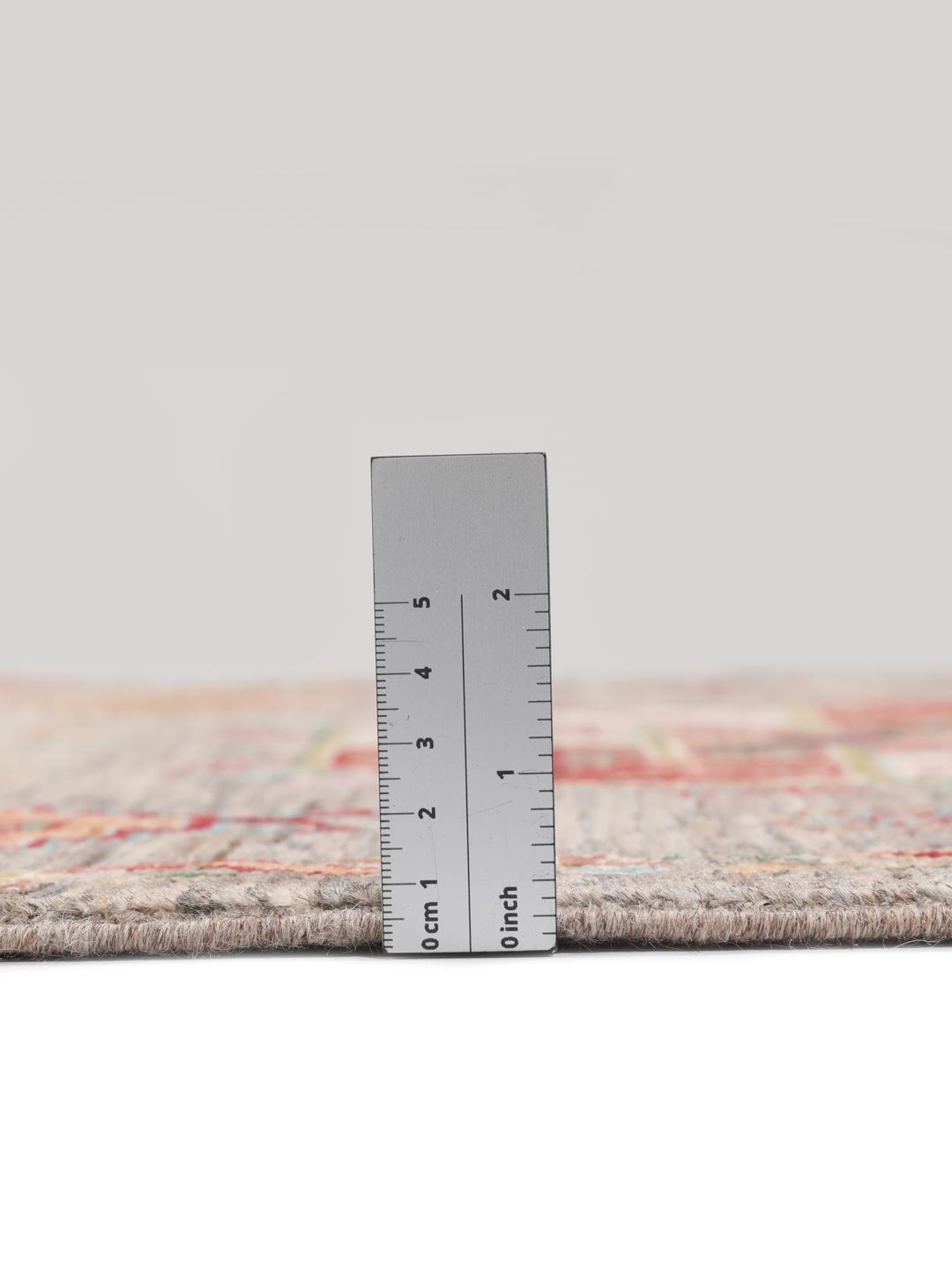 A unique Afghan wool runner featuring colourful geometric motifs on a grey background