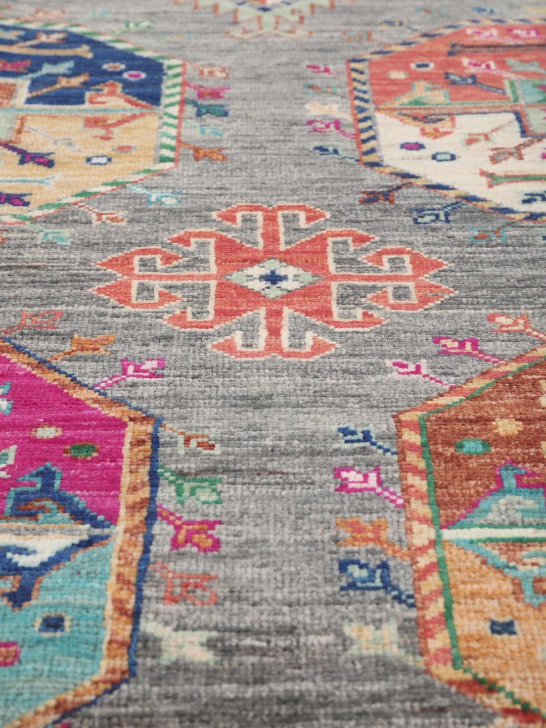 Hand-knotted Afghan rug with a grey field and colourful geometric motifs