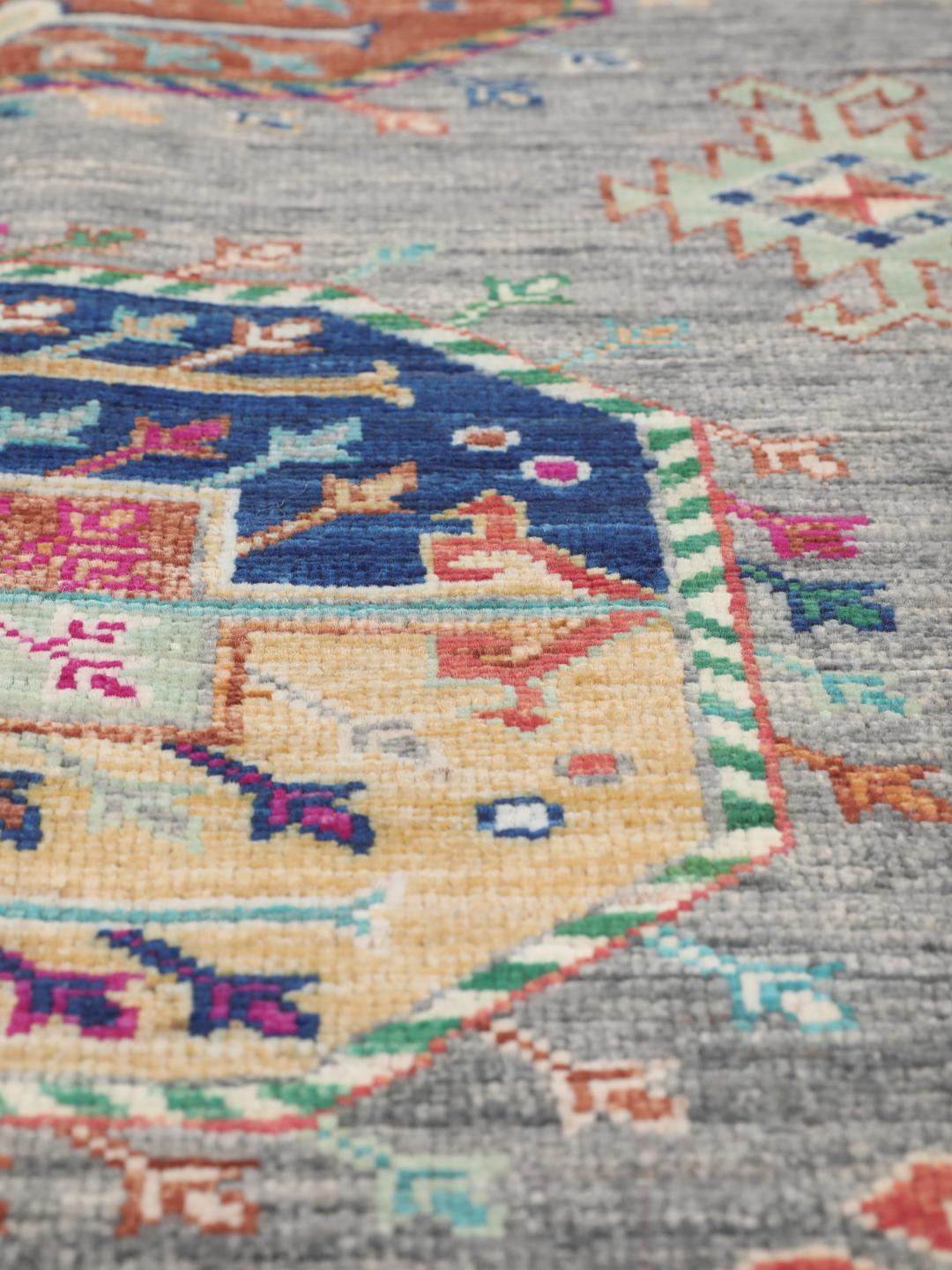 Hand-knotted Afghan rug with a grey field and colourful geometric motifs