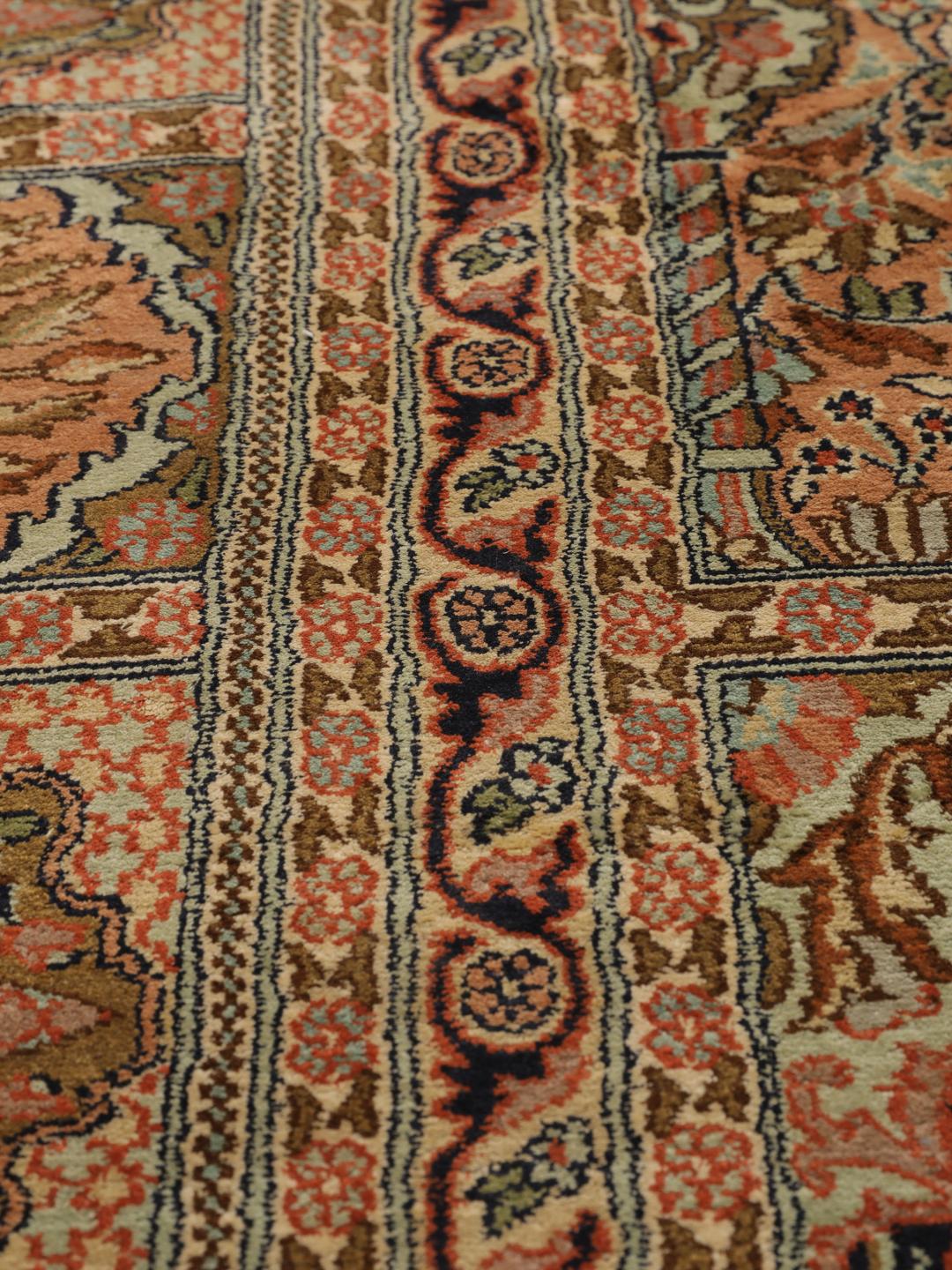 A luxurious hand-knotted Kashmir silk rug from India with an intricate beige garden panel design.