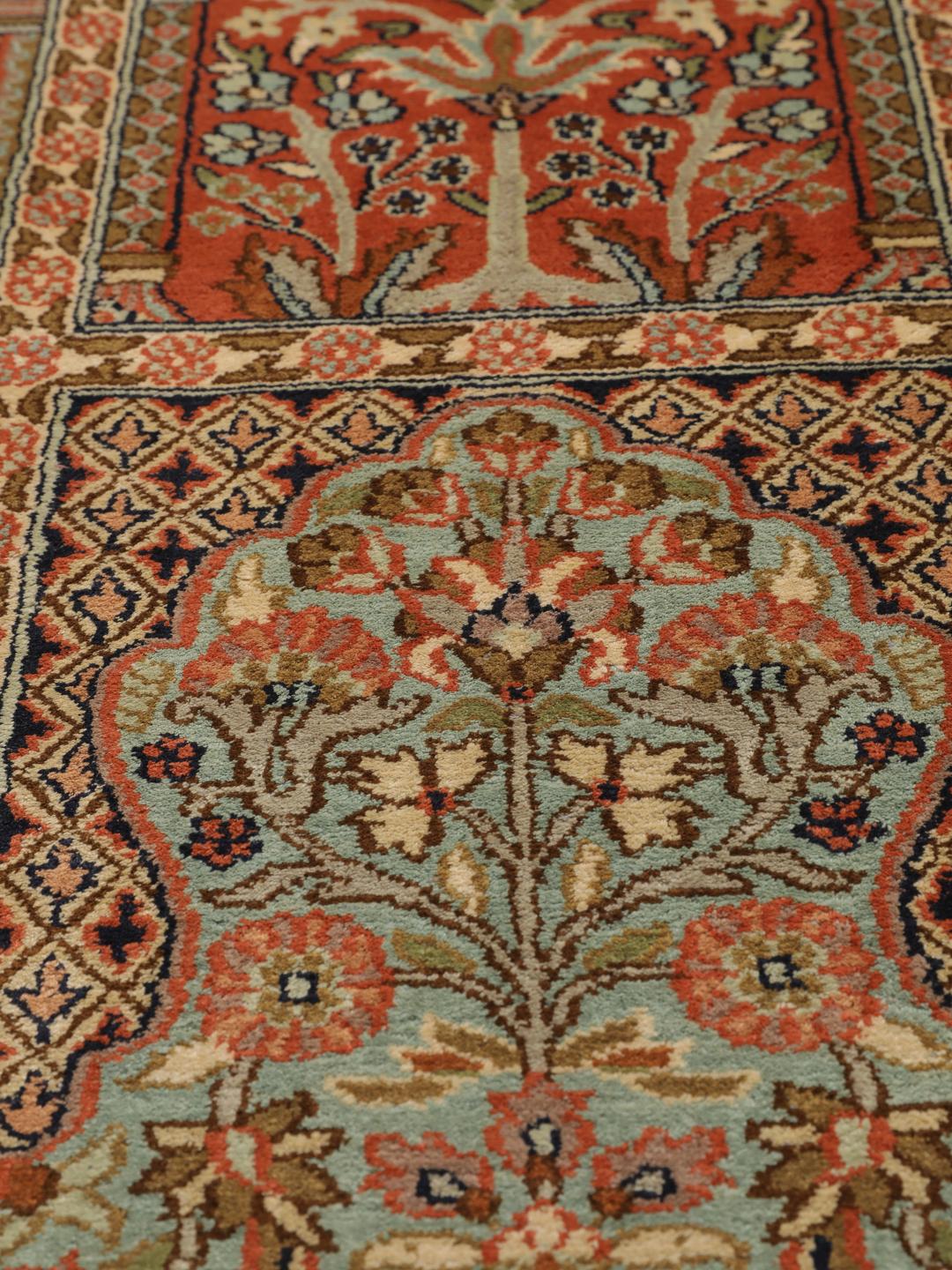 A luxurious hand-knotted Kashmir silk rug from India with an intricate beige garden panel design.
