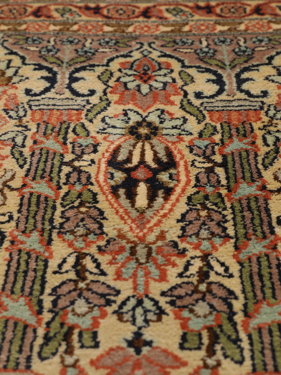 A luxurious hand-knotted Kashmir silk rug from India with an intricate beige garden panel design.