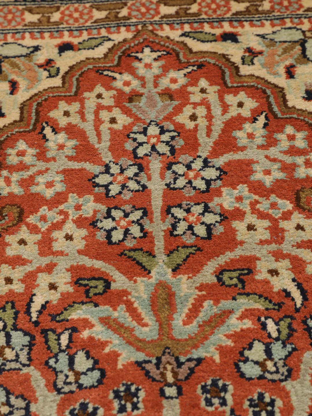 A luxurious hand-knotted Kashmir silk rug from India with an intricate beige garden panel design.