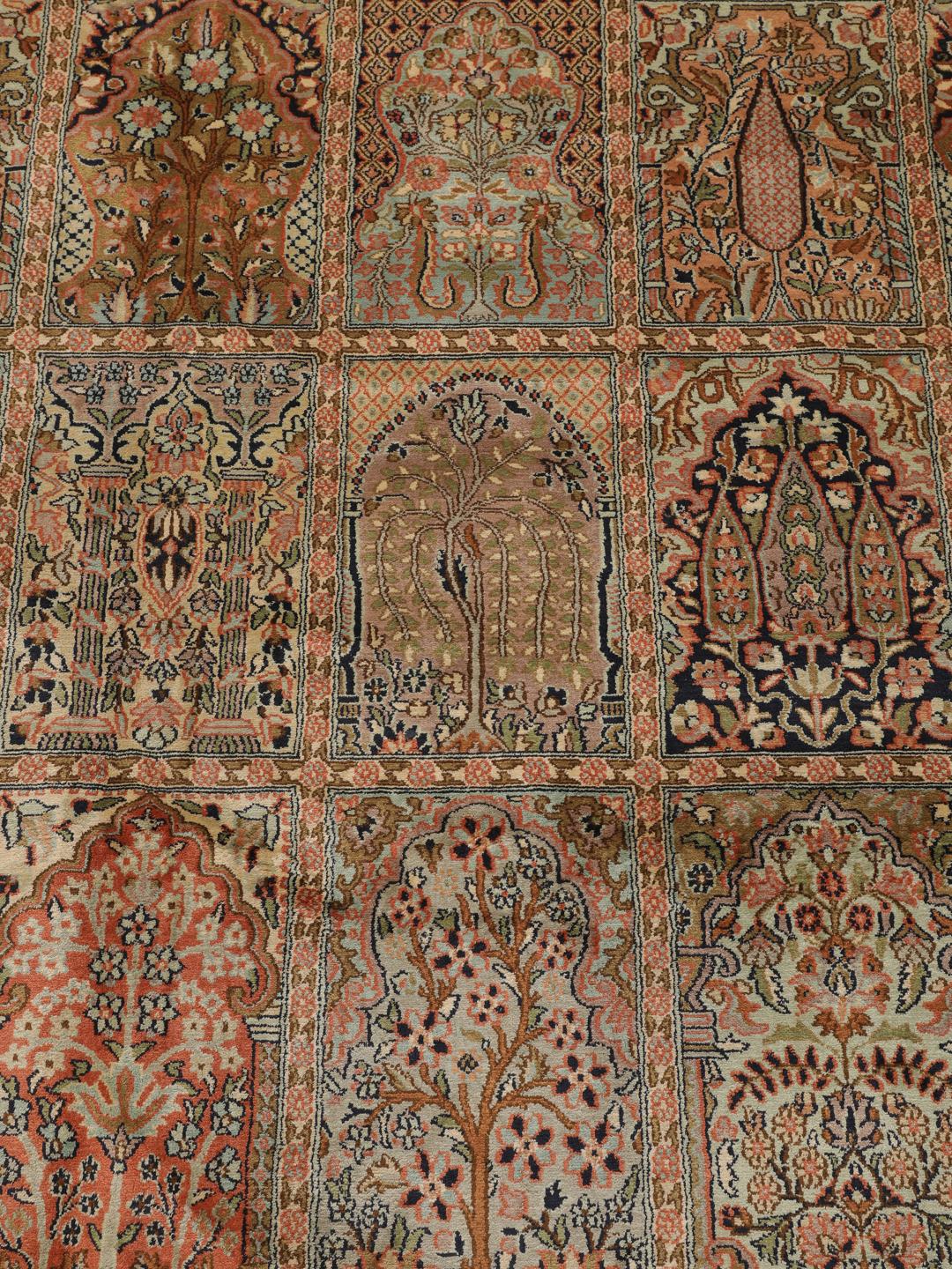 A luxurious hand-knotted Kashmir silk rug from India with an intricate beige garden panel design.