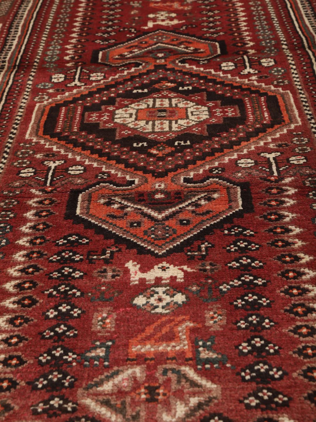 Hand-knotted Middle Eastern Shiraz runner in red and black wool