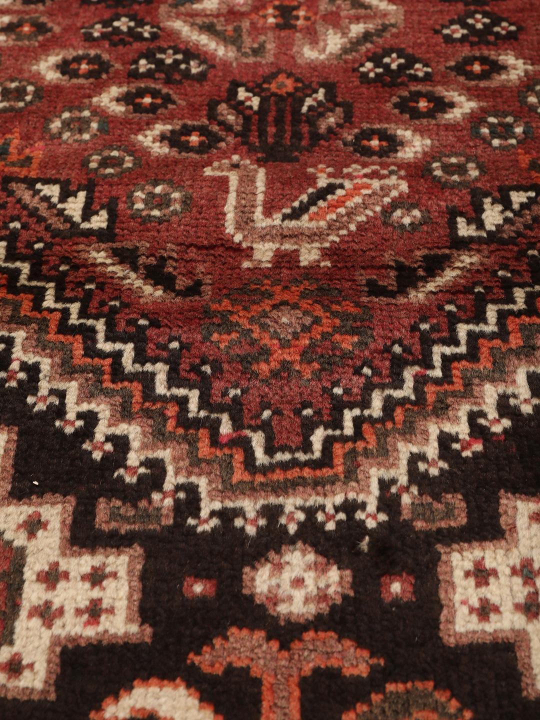 Hand-knotted Middle Eastern Shiraz runner in red and black wool