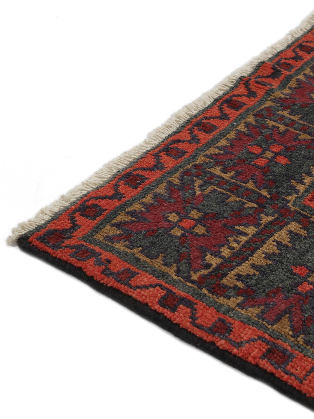 Hand-knotted Lori rug from the Middle East in dark-red and charcoal tones.