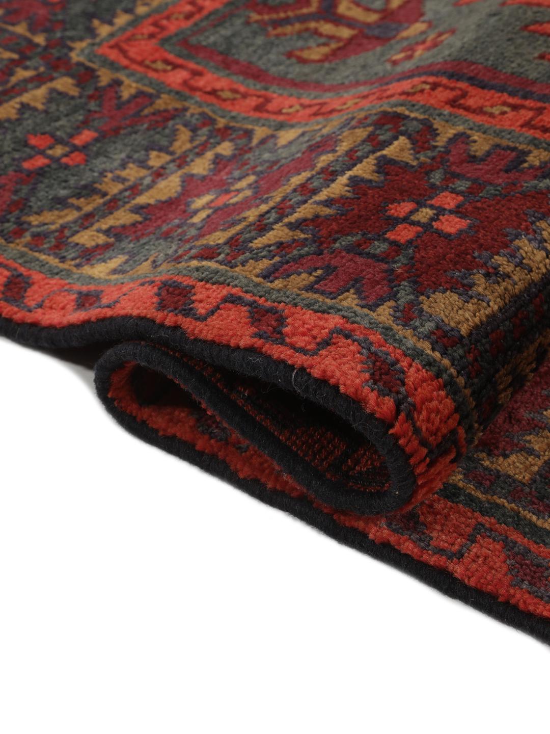 Hand-knotted Lori rug from the Middle East in dark-red and charcoal tones.
