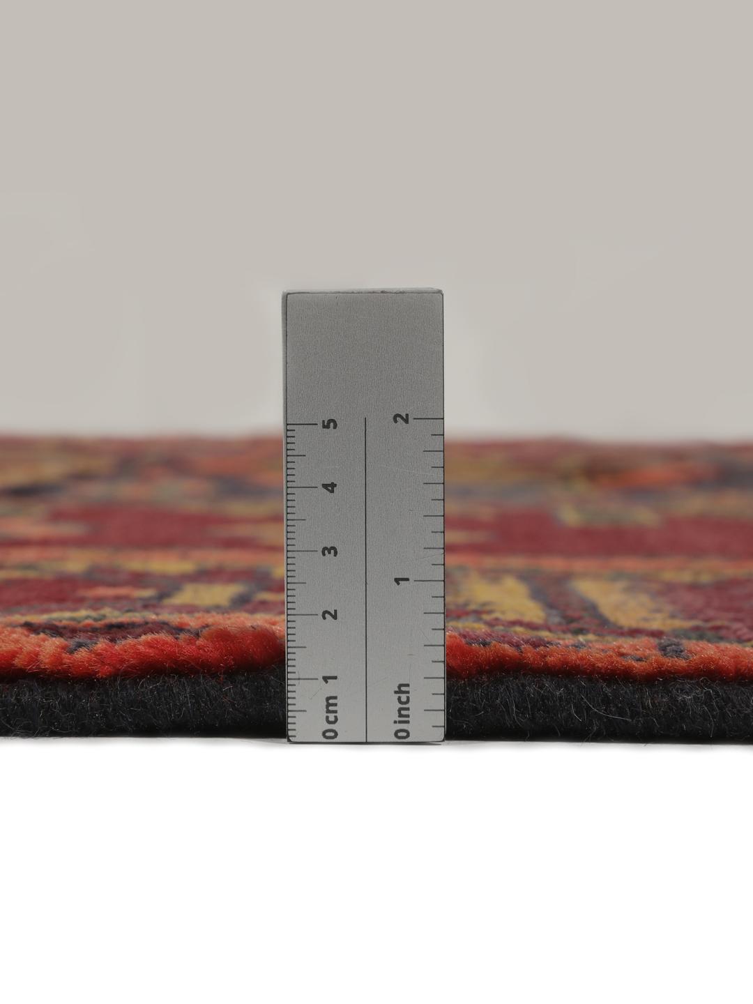 Hand-knotted Lori rug from the Middle East in dark-red and charcoal tones.