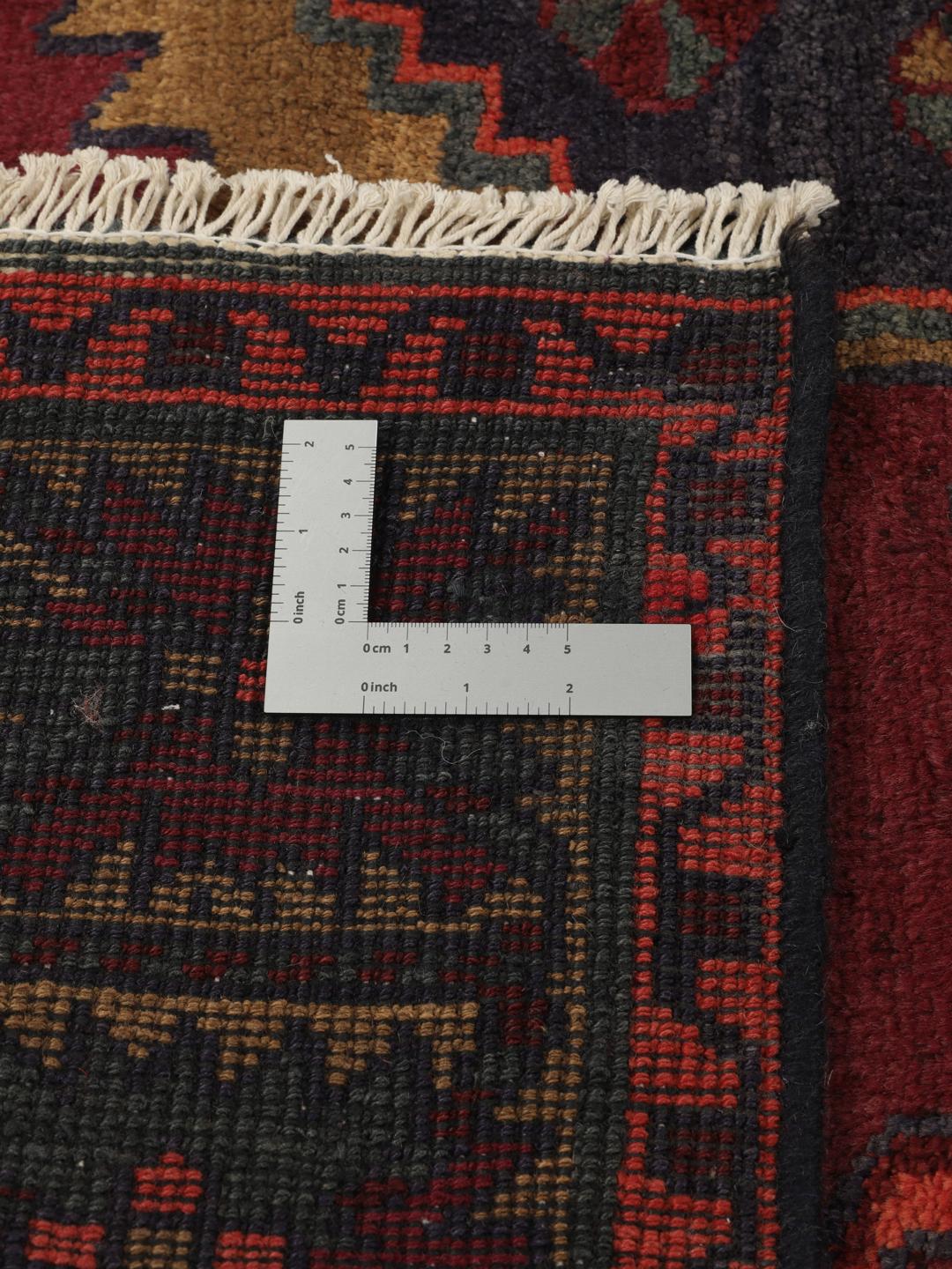 Hand-knotted Lori rug from the Middle East in dark-red and charcoal tones.
