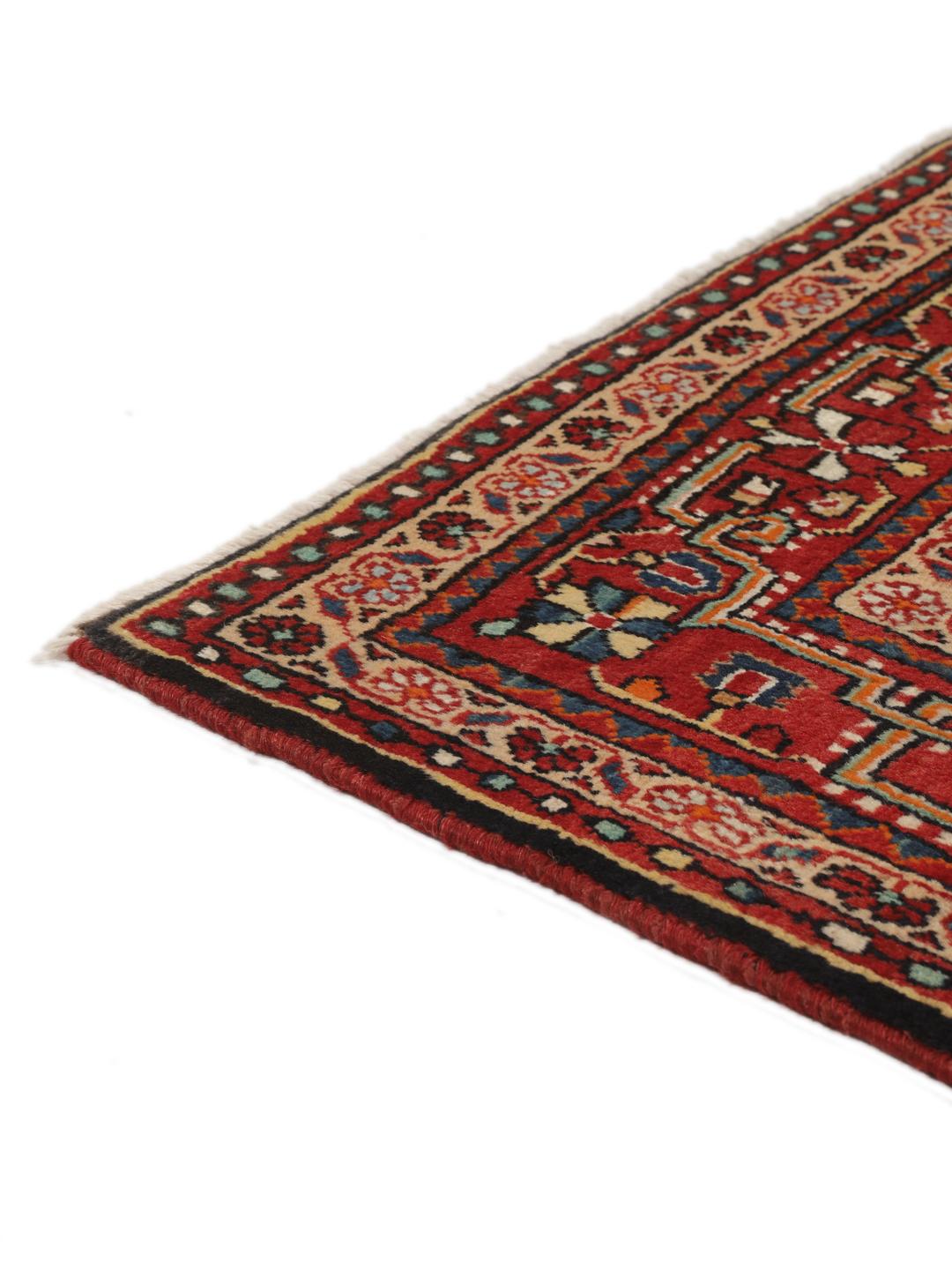 Handgeknoopt Hamadan tapijt uit het Midden-Oosten met een donkerrood en zwart floraal medaillonontwerp