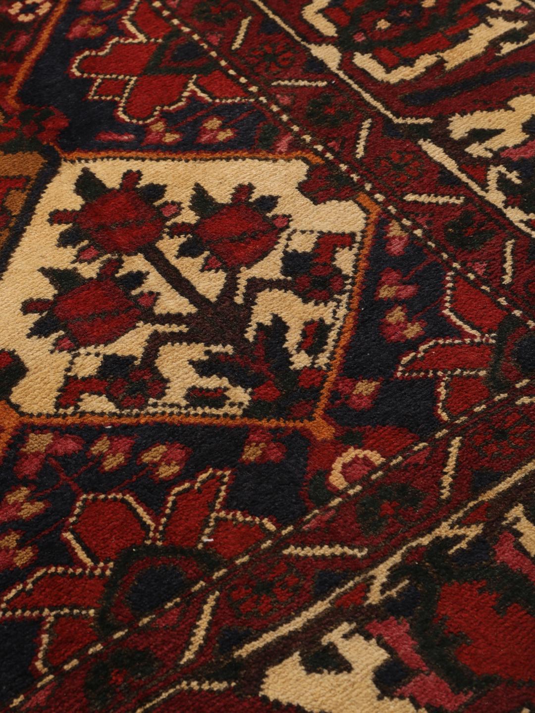 Hand-knotted Middle Eastern Bakhtiari rug in dark-red and cream tones